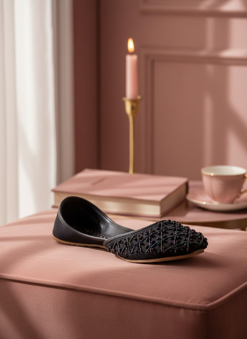 Ujaala Raani black jutti with intricate lattice beadwork, perfect for festive occasions.