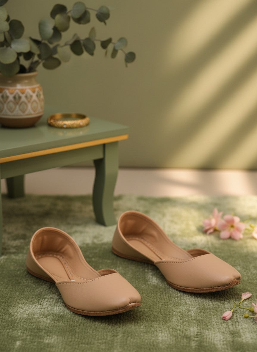 Ujaala Noora plain beige leather jutti with a pointed toe and comfortable fit.
