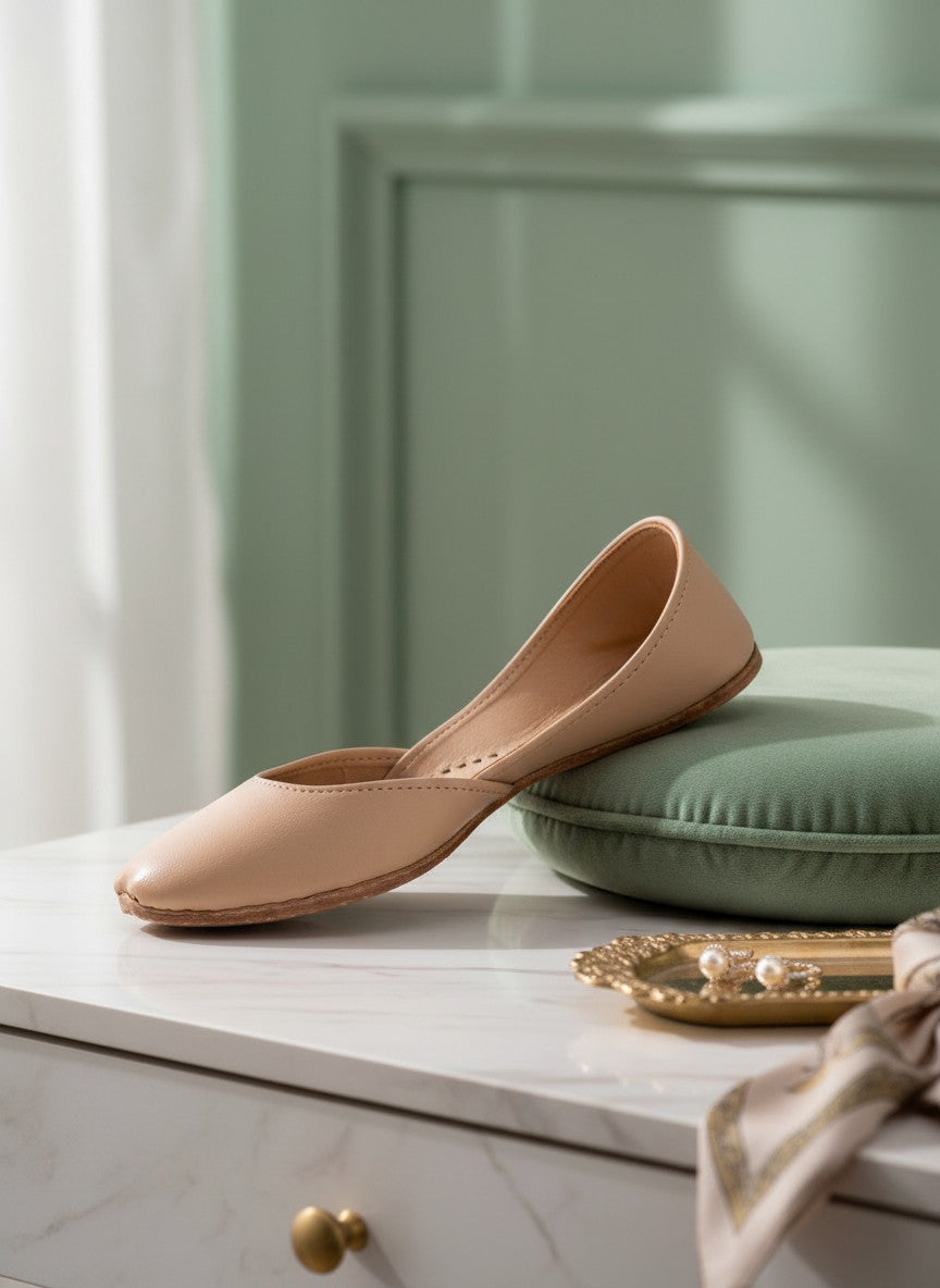 Ujaala Noora plain beige leather jutti with a pointed toe and comfortable fit.