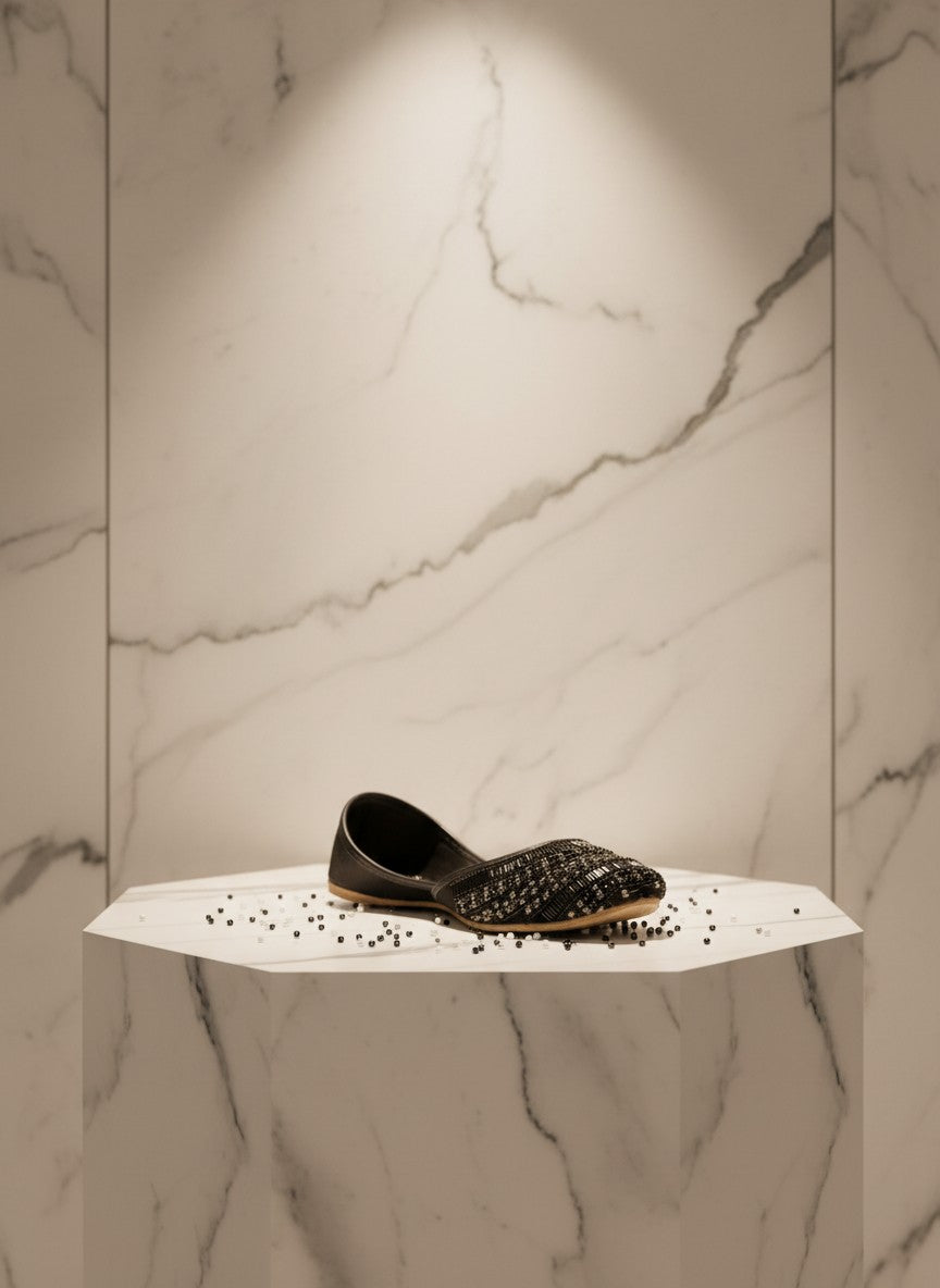 Ujaala Siyahi black jutti embellished with intricate black beadwork and crystal detailing. Elegant flat shoes for evening wear.