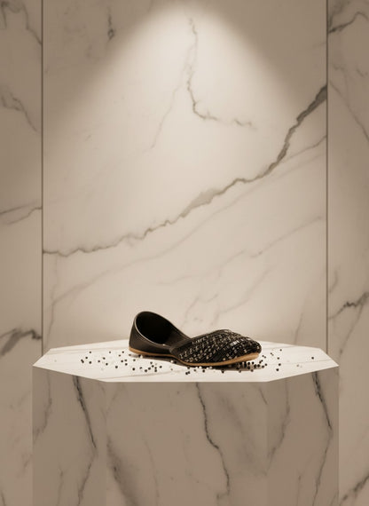 Ujaala Siyahi black jutti embellished with intricate black beadwork and crystal detailing. Elegant flat shoes for evening wear.