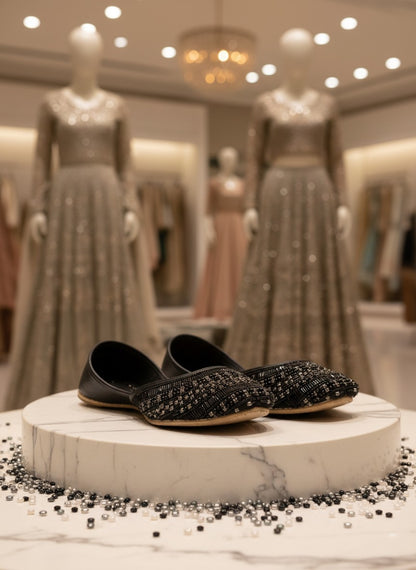 Ujaala Siyahi black jutti flats with intricate black beadwork and crystal detailing on the toe.