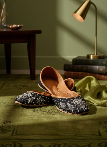 Ujaala Maya black jutti with intricate silver embroidery and beadwork on the toe.
