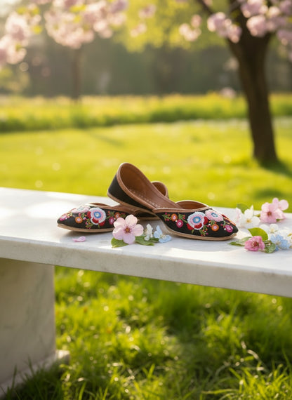 Ujaala Rangrez black handcrafted khussa with vibrant floral embroidery and bead detailing, perfect for festive occasions.
