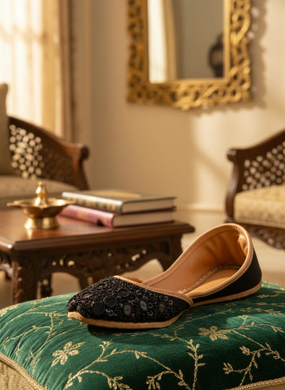 Ujaala black jutti embellished with black sequins and beads, featuring a tan leather lining and sole.