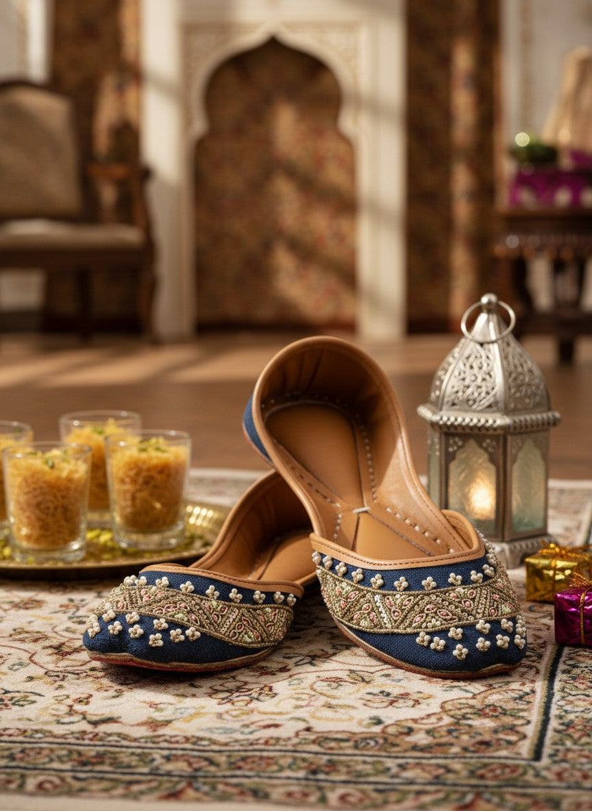 Ujaala Badshah blue jutti with intricate gold, pearl, and bead embroidery. Traditional South Asian footwear.