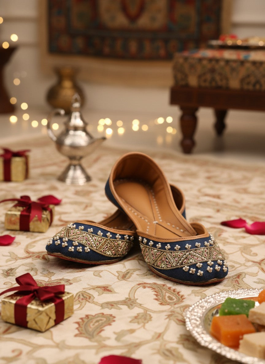 Ujaala Badshah blue jutti with intricate gold embroidery and pearl details. Traditional South Asian footwear.