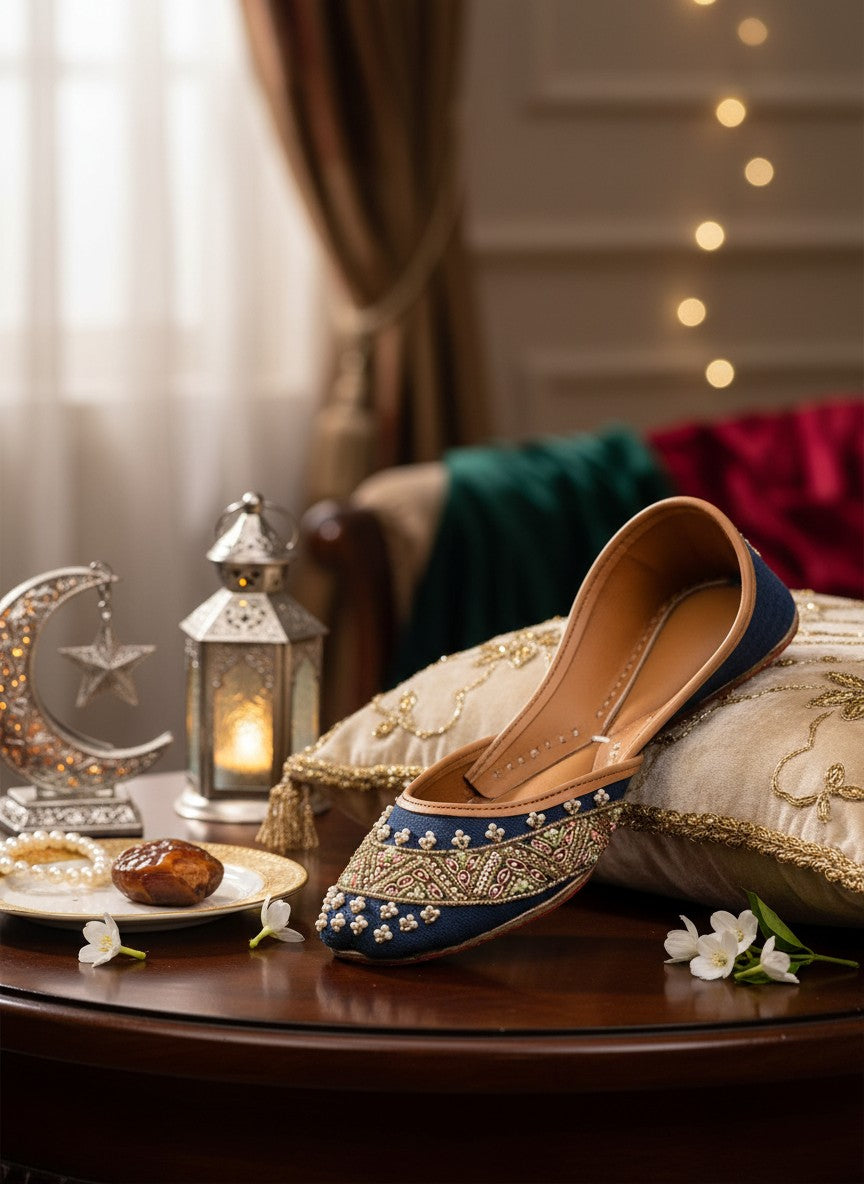 Ujaala Badshah blue jutti with intricate gold, pearl, and pink bead embroidery. Traditional South Asian footwear.