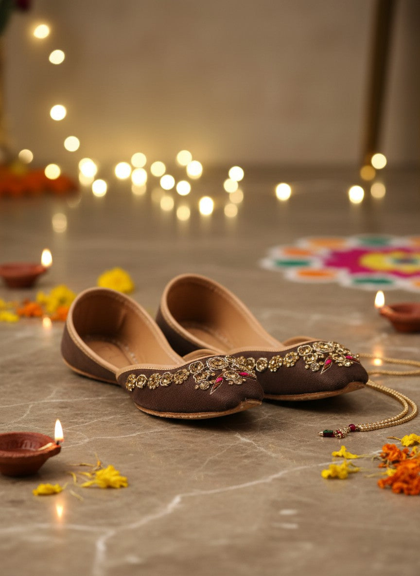 Ujaala brown suede Punjabi juttis for women with intricate gold and pink bead embroidery.