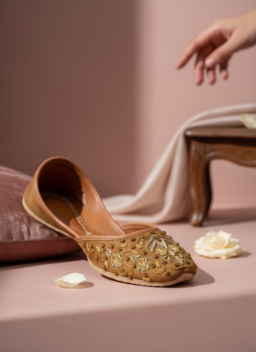 Ujaala brown suede jutti with intricate gold thread and bead embroidery. Traditional Indian flat shoe.
