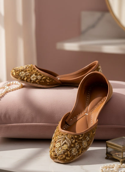 Ujaala brown suede jutti with intricate gold and bead embroidery. Traditional Indian flat shoe.
