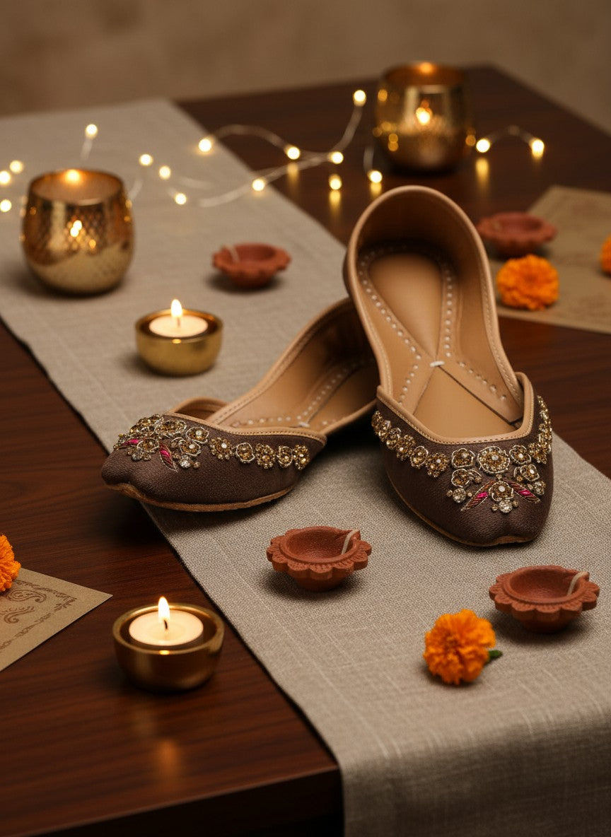 Ujaala brown suede Punjabi juttis for women with intricate gold and pink floral bead embellishments.