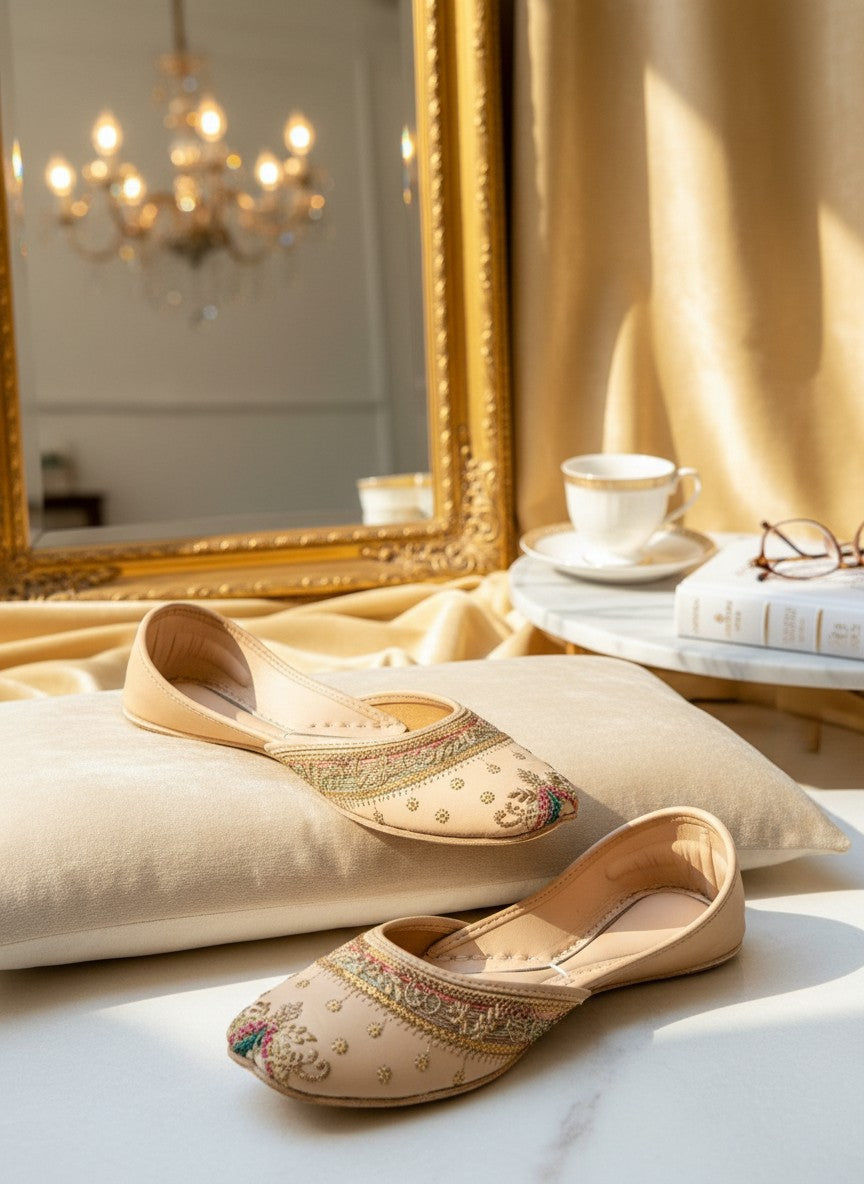 Ujaala Raah champagne jutti with intricate embroidery and colourful thread details. Flat, slip-on ethnic footwear.