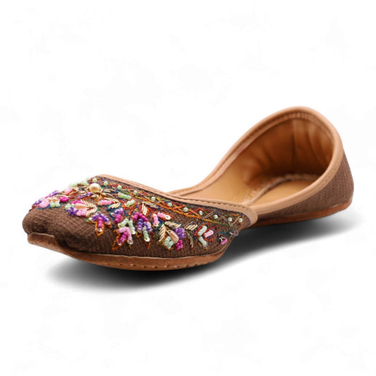 Ujaala deep chocolate brown jutti with intricate multi-colored bead and thread embroidery on the toe.