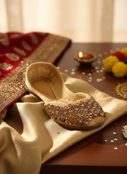 Ujaala gold velvet jutti embellished with rhinestones and beads. Traditional Indian flat shoes.