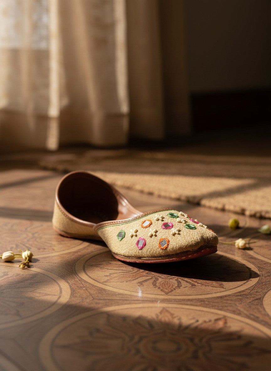 Ujaala Zarqa golden beige jutti with multicolor mirror work and embroidery. Traditional festive footwear.