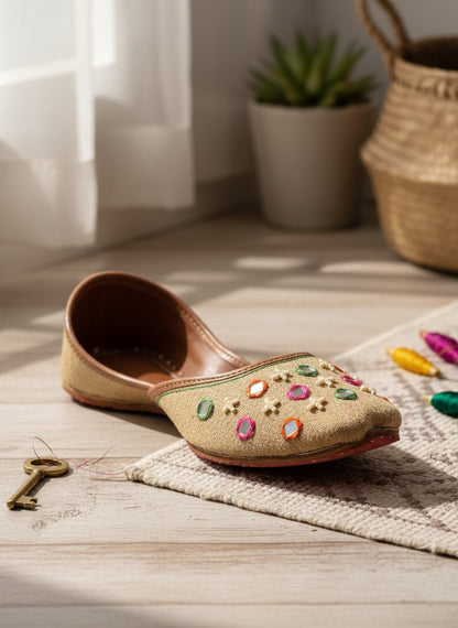 Ujaala Zarqa golden beige jutti with multicolor mirror and embroidery details. Traditional festive footwear.