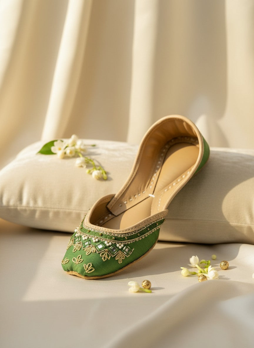 Ujaala green silk jutti with gold embroidery and pearl embellishments, traditional Indian flat shoe.