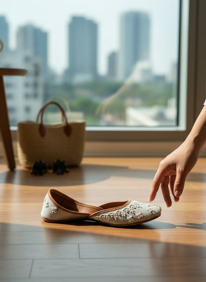 Ujaala Roshan grey jutti with white embroidery and brown leather lining.