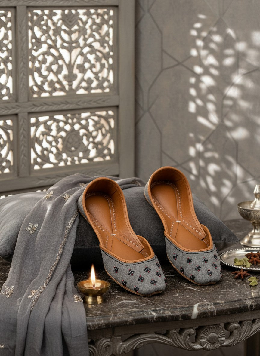 Ujaala Nawabi grey jutti with beaded embellishments and tan leather lining.
