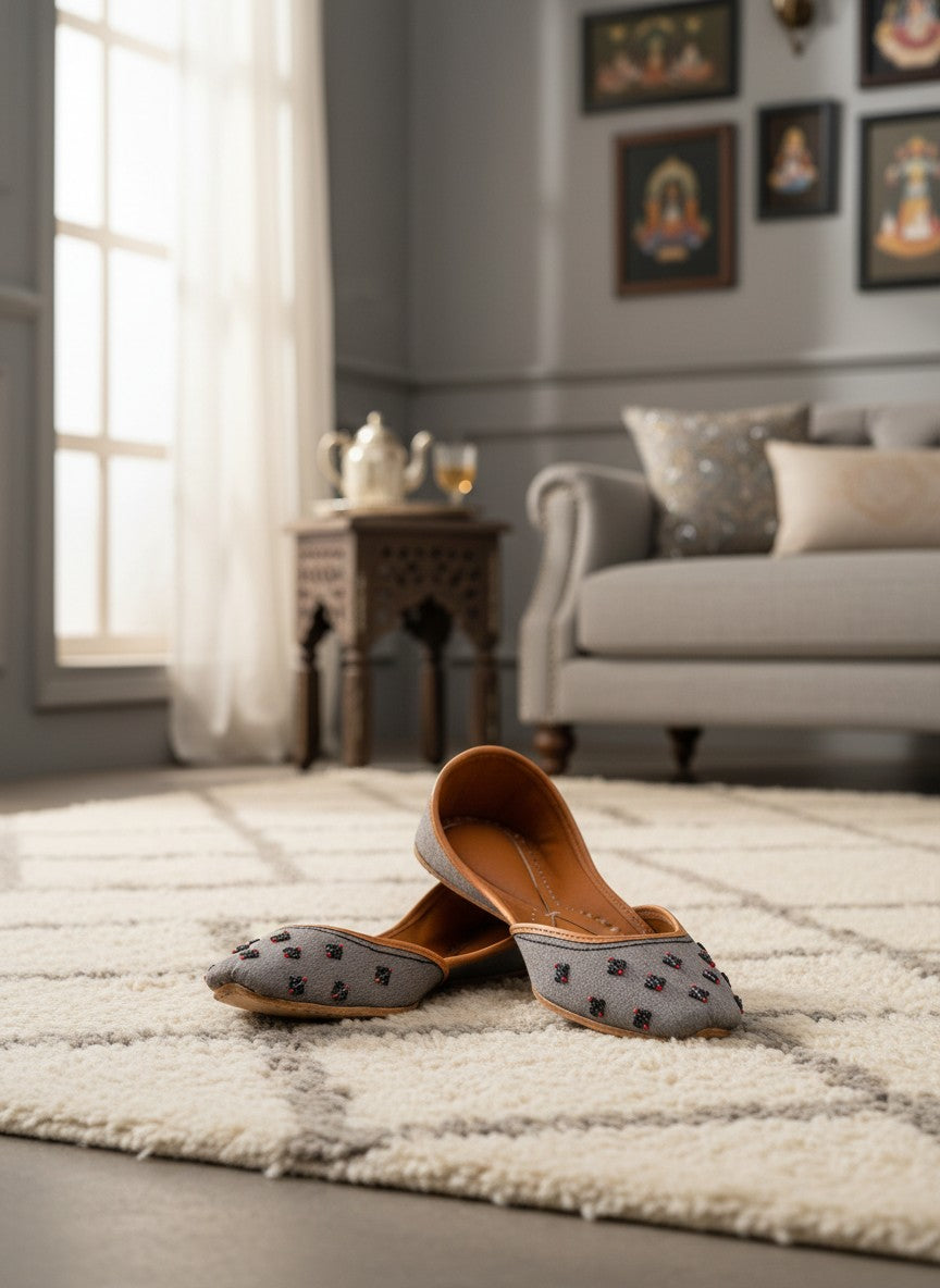Ujaala Nawabi grey jutti with beaded embellishments and tan leather lining.