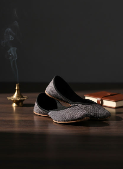 Ujaala Isha grey jutti with textured fabric and black velvet trim. Elegant, handcrafted flat shoe.