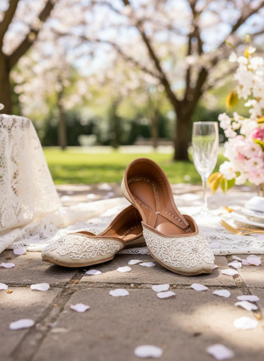Ujaala Mehar ivory handcrafted jutti with white bead floral embroidery, perfect for bridal and festive occasions.