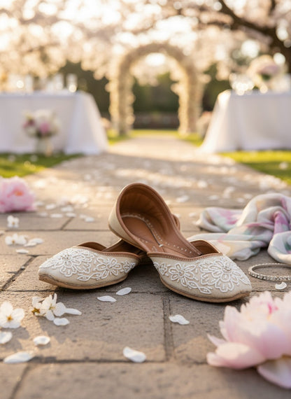 Ujaala Mehar ivory handcrafted jutti with white bead floral embroidery, ideal for bridal and festive occasions.