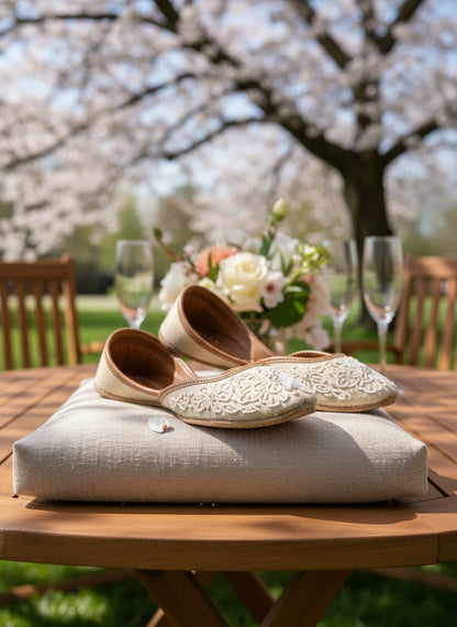 Ujaala Mehar ivory handcrafted jutti with white bead floral embroidery, perfect for bridal and festive occasions.