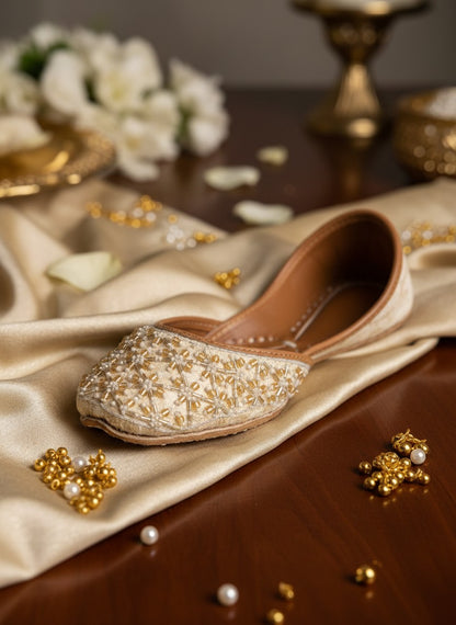 Ujaala Piyu ivory velvet khussa embellished with pearl and gold bead embroidery.