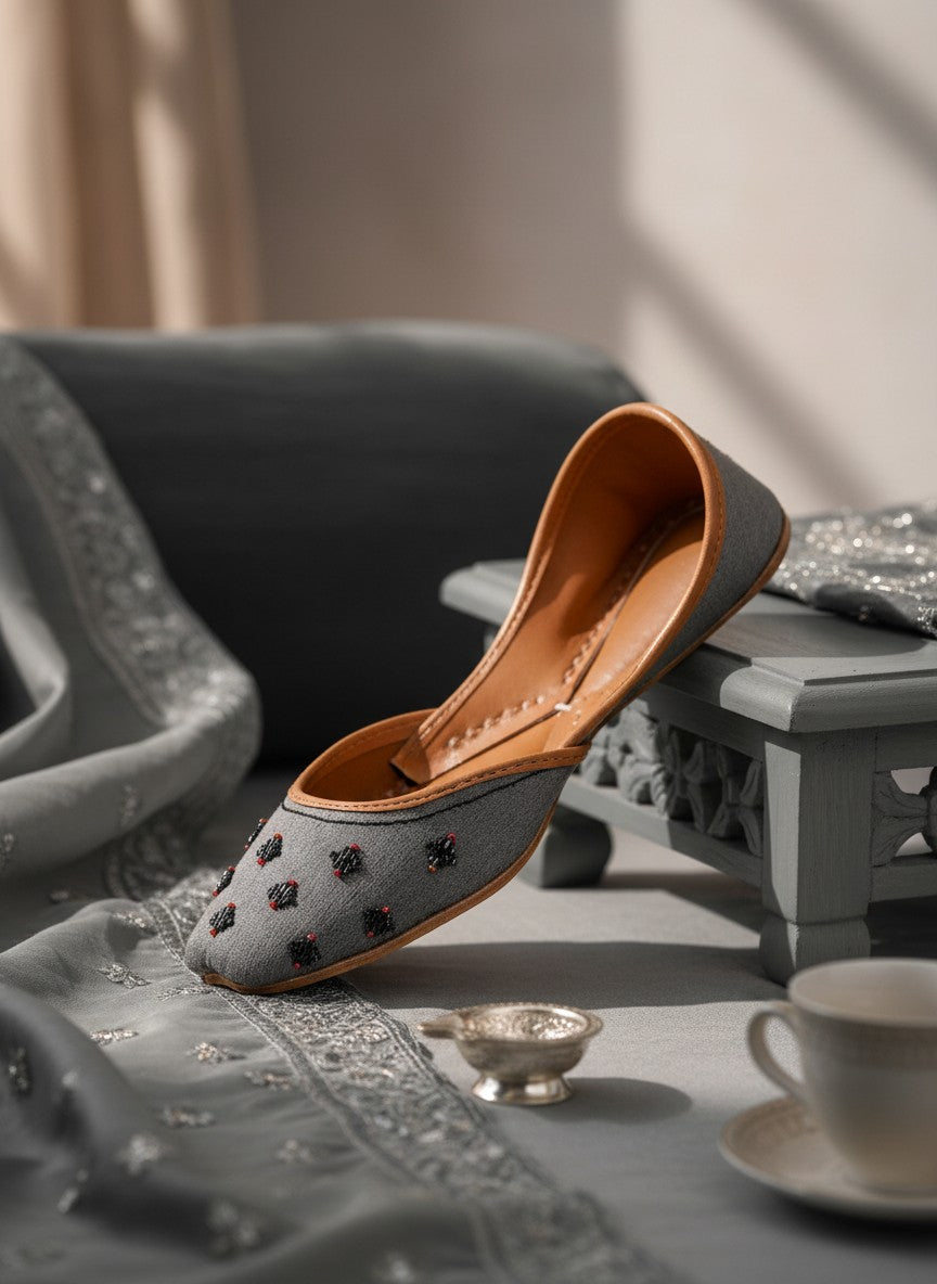 Ujaala Nawabi grey jutti with beaded embellishments and tan leather lining.
