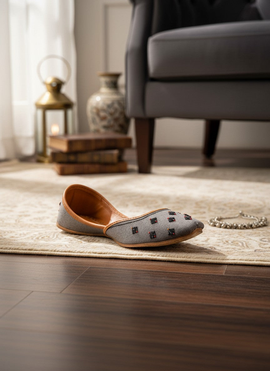 Ujaala Nawabi grey jutti with beaded embellishments and tan leather lining.