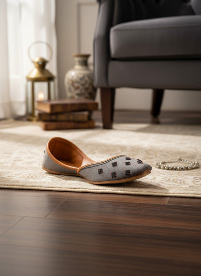 Ujaala Nawabi grey jutti with beaded embellishments and tan leather lining.