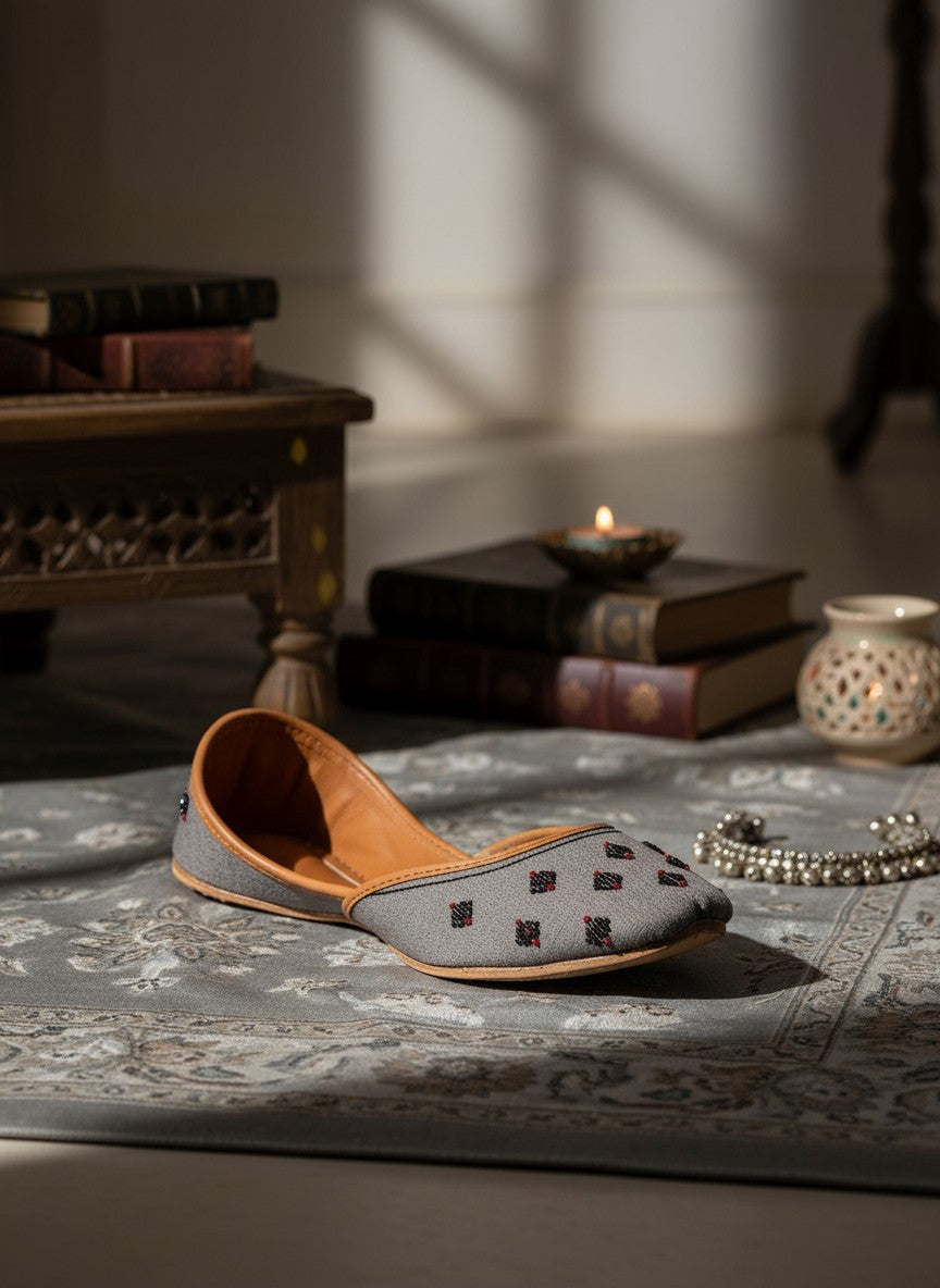 Ujaala Nawabi grey jutti with beaded embellishments and tan leather lining.