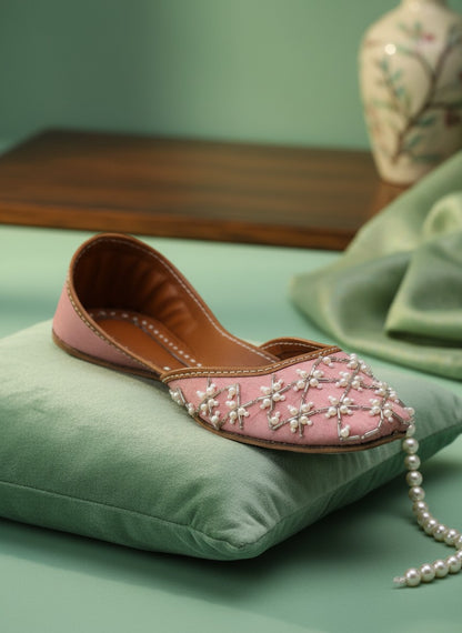 Ujaala Roshanayat pink jutti embellished with pearls and beads, featuring a pointed toe and traditional Indian design.