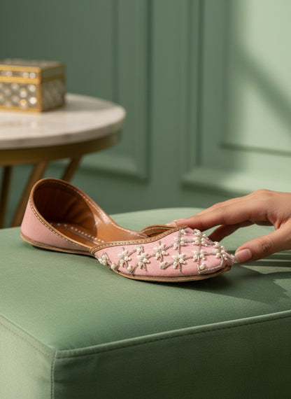 Ujaala Roshanayat pink jutti embellished with pearls and beads, featuring a pointed toe and flat sole.