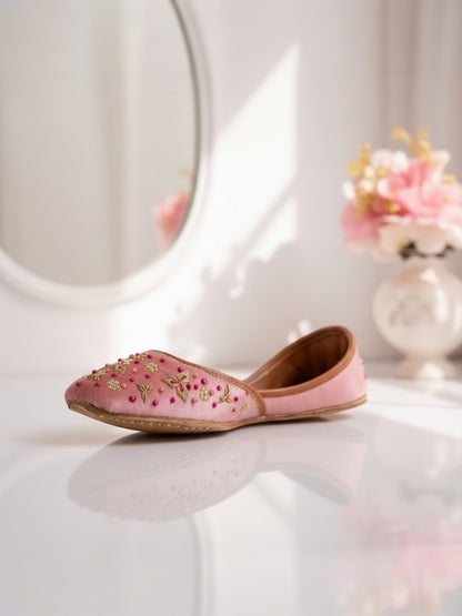 Ujaala Sapna pink velvet jutti with gold embroidery and pink bead accents. Handcrafted.