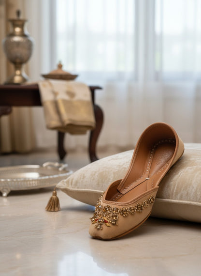 Ujaala Rangeen Kali beige velvet jutti with intricate gold and crystal embellishments.