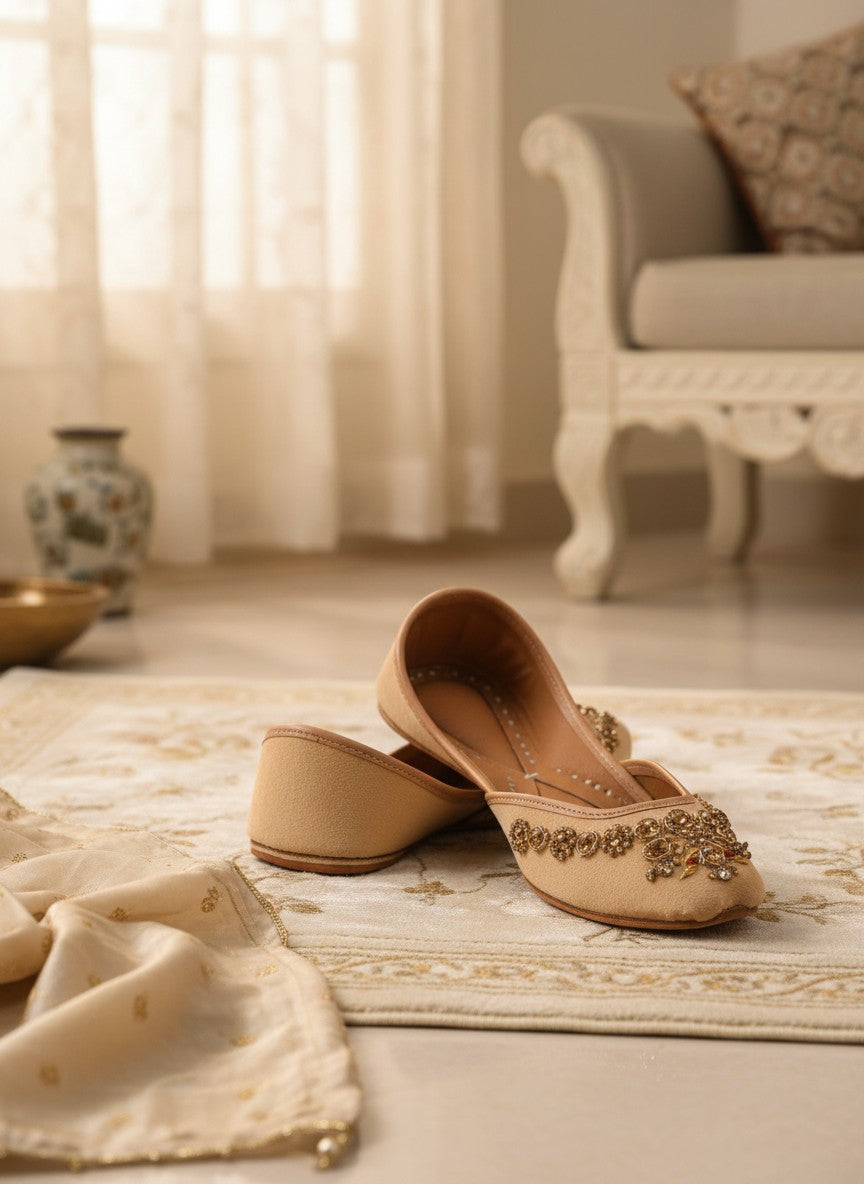 Ujaala Rangeen Kali beige velvet jutti with intricate gold and crystal embellishments.