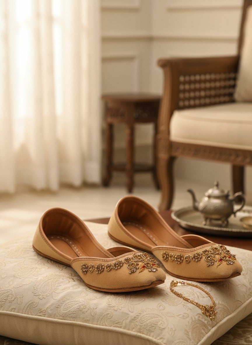 Ujaala Rangeen Kali beige velvet jutti with intricate gold and crystal embellishments.