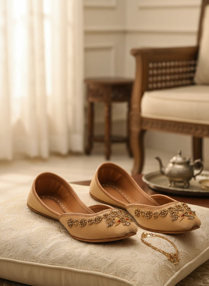 Ujaala Rangeen Kali beige velvet jutti with intricate gold and crystal embellishments.