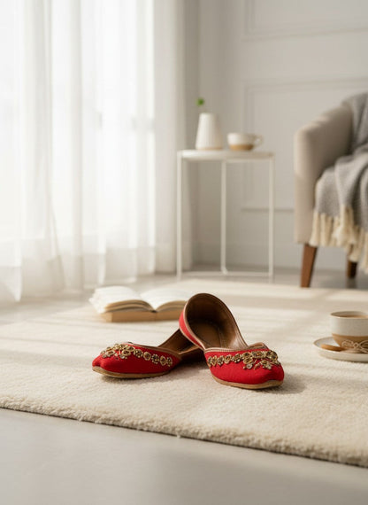 Ujaala red embroidered Punjabi jutti for women with floral bead and rhinestone embellishments.