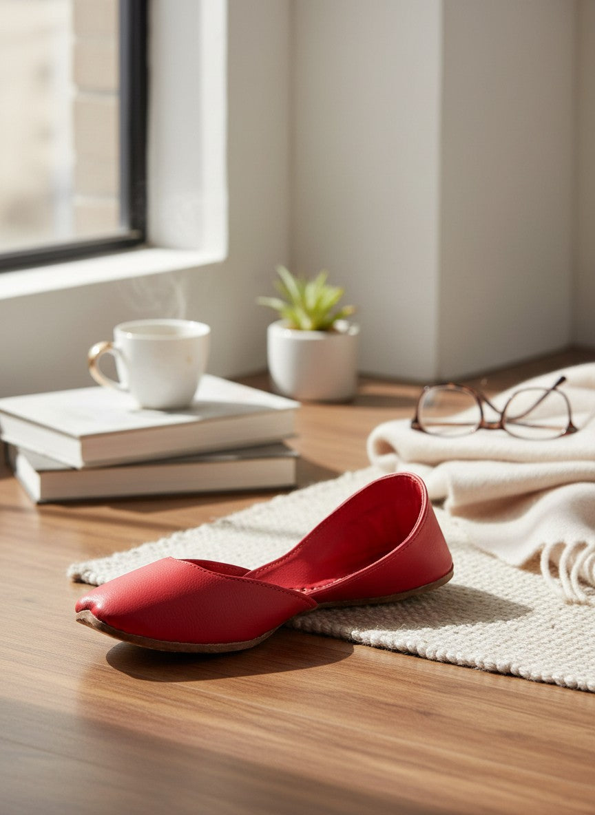 Ujaala Noora red plain leather jutti with a pointed toe and comfortable fit.