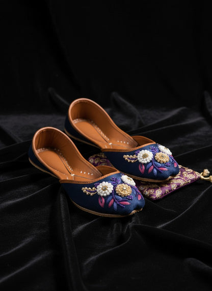 Ujaala Naazneen royal blue velvet jutti with floral bead embroidery and leather sole.