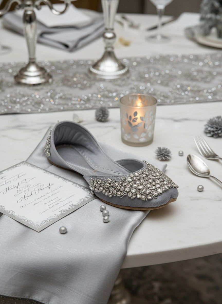 Ujaala Aurora silver velvet jutti embellished with clear crystals and beads. Elegant flat shoe for women.