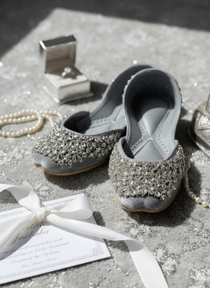 Ujaala Aurora silver velvet jutti embellished with clear crystals and beads. Elegant flat shoe for women.