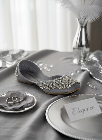Ujaala Aurora silver velvet jutti embellished with clear crystals and beads. Elegant flat shoe.